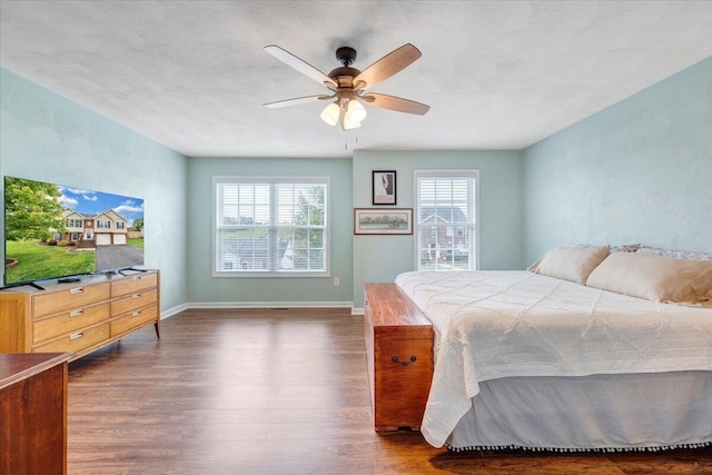 590 Keystone Dr NW, Christiansburg, VA 24073 - bedroom with dark wood finished floors, baseboards, and a ceiling fan