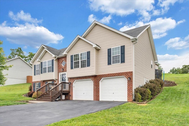 590 Keystone Dr NW, Christiansburg, VA 24073 - raised ranch with an attached garage, driveway, a front lawn, and brick siding