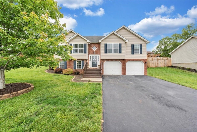 590 Keystone Dr NW, Christiansburg, VA 24073 - raised ranch featuring brick siding, driveway, and a garage