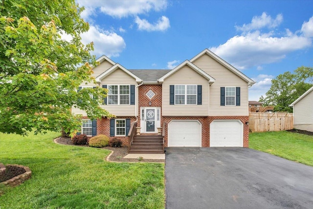 590 Keystone Dr NW, Christiansburg, VA 24073 - split foyer home with driveway, brick siding, and a garage