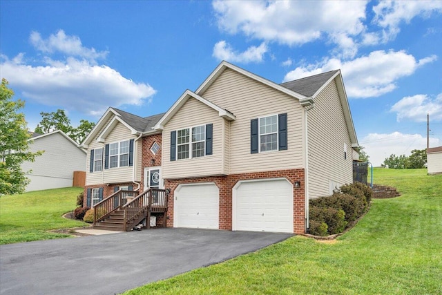 590 Keystone Dr NW, Christiansburg, VA 24073 - split foyer home featuring a garage, asphalt driveway, brick siding, and a front yard