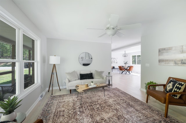 1132 Bancroft Ln, Goode, VA 24556 - living area with wood finished floors, ceiling fan, and baseboards