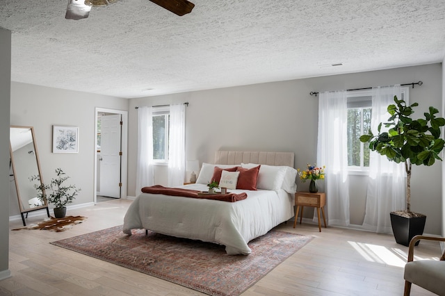1132 Bancroft Ln, Goode, VA 24556 - bedroom featuring hardwood / wood-style flooring, a textured ceiling, and baseboards