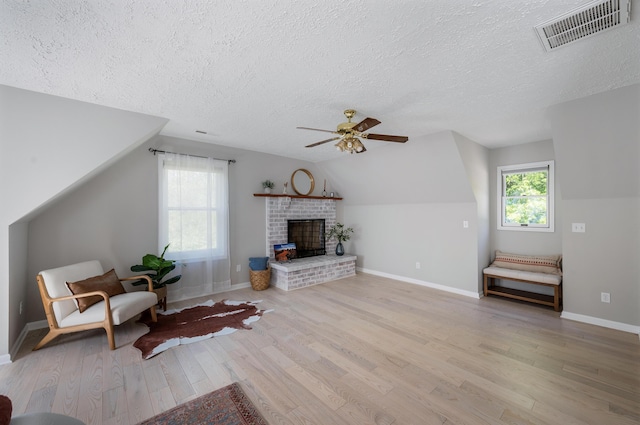 1132 Bancroft Ln, Goode, VA 24556 - living room with a textured ceiling, light wood-type flooring, a ceiling fan, baseboards, and lofted ceiling