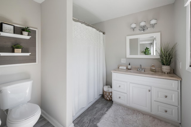 1132 Bancroft Ln, Goode, VA 24556 - full bathroom with vanity, wood finished floors, toilet, and a shower with shower curtain