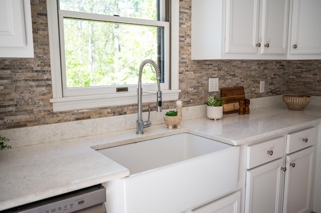 1132 Bancroft Ln, Goode, VA 24556 - kitchen featuring a sink, dishwashing machine, and white cabinets