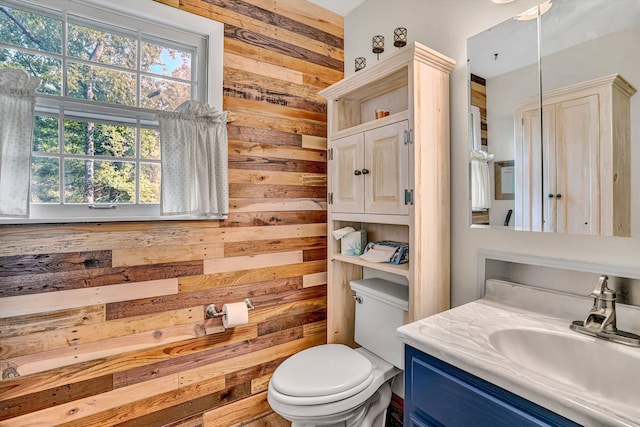 508 Hemlock Shores Dr, Goodview, VA 24095 - bathroom with wood walls, vanity, and toilet