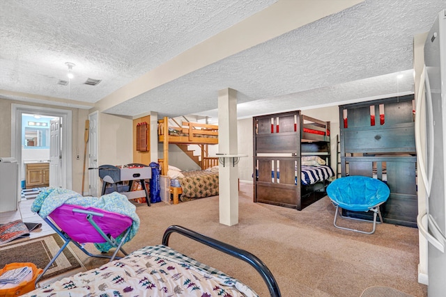 508 Hemlock Shores Dr, Goodview, VA 24095 - bedroom featuring carpet, a textured ceiling, and freestanding refrigerator
