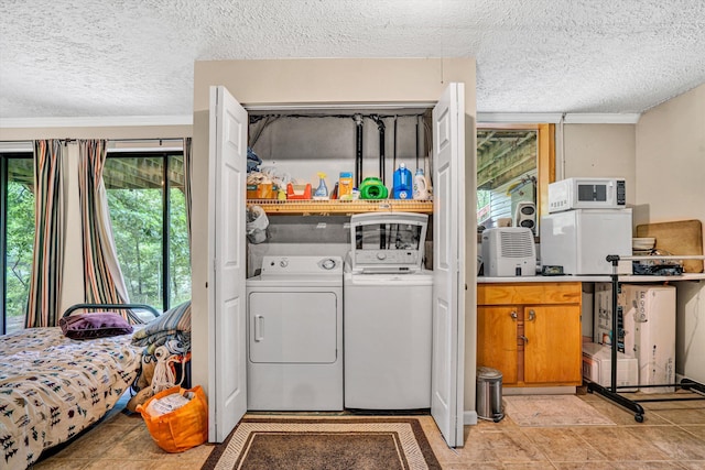508 Hemlock Shores Dr, Goodview, VA 24095 - washroom featuring washer and clothes dryer and a textured ceiling