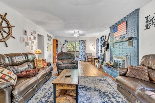 508 Hemlock Shores Dr, Goodview, VA 24095 - living area with wood finished floors, a fireplace, and ceiling fan