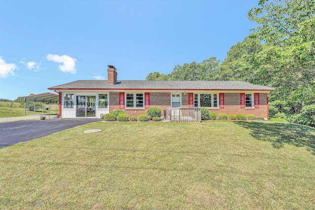 20083 Snow Creek Rd, Penhook, VA 24137 - single story home with brick siding, a front lawn, asphalt driveway, and a carport