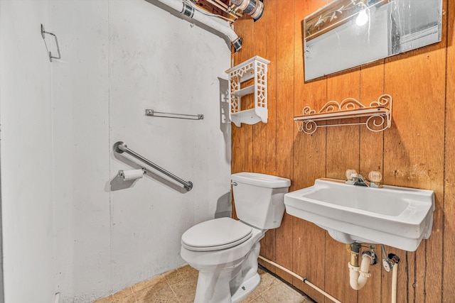 20083 Snow Creek Rd, Penhook, VA 24137 - half bathroom with toilet, wood walls, and tile patterned floors