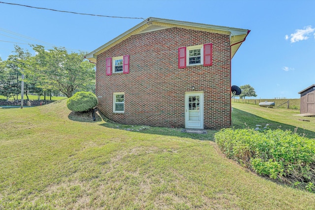 20083 Snow Creek Rd, Penhook, VA 24137 - rear view of property featuring brick siding and a yard