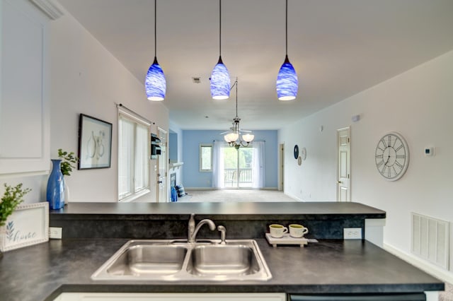 1103 Mariners Way Unit 5, Huddleston, VA 24104 - kitchen featuring a sink, dark countertops, open floor plan, and pendant lighting