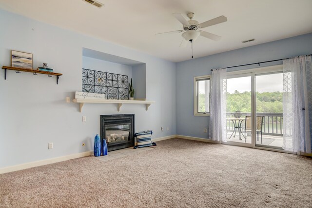 1103 Mariners Way Unit 5, Huddleston, VA 24104 - unfurnished living room featuring carpet, a glass covered fireplace, baseboards, and ceiling fan