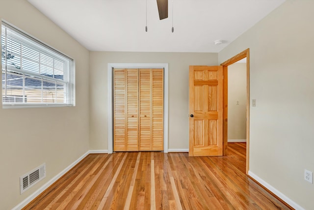 1801 Bluemont Ave SW Unit G, Roanoke, VA 24015 - unfurnished bedroom with light wood-style floors, a closet, baseboards, and a ceiling fan