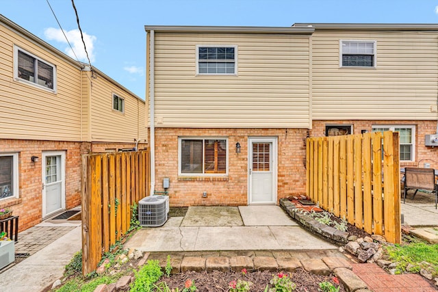 1801 Bluemont Ave SW Unit G, Roanoke, VA 24015 - rear view of property featuring central air condition unit, a patio, and brick siding
