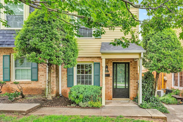 1801 Bluemont Ave SW Unit G, Roanoke, VA 24015 - entrance to property featuring a shingled roof and brick siding