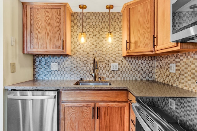 1801 Bluemont Ave SW Unit G, Roanoke, VA 24015 - kitchen with appliances with stainless steel finishes, a sink, backsplash, and pendant lighting