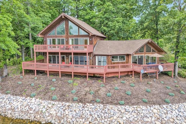 510 Crestview Rd, Wirtz, VA 24184 - back of house with roof with shingles, a wooden deck, and a forest view