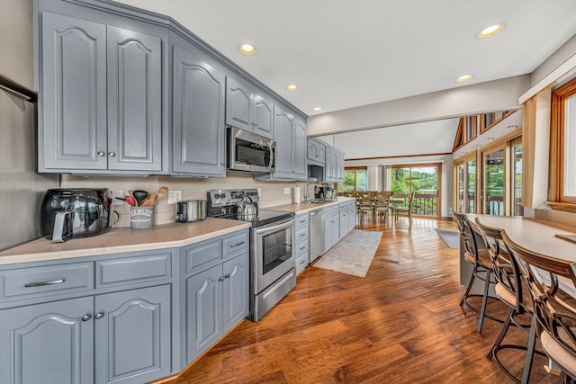 510 Crestview Rd, Wirtz, VA 24184 - kitchen with appliances with stainless steel finishes, gray cabinets, wood finished floors, light countertops, and recessed lighting