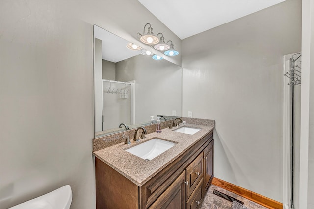 510 Crestview Rd, Wirtz, VA 24184 - bathroom featuring double vanity, toilet, an enclosed shower, and baseboards