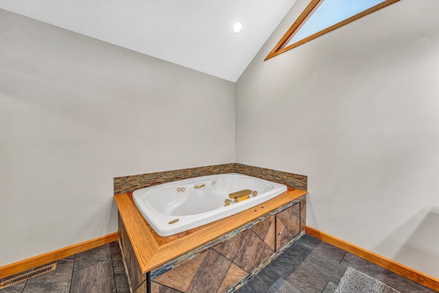 510 Crestview Rd, Wirtz, VA 24184 - full bath with baseboards, lofted ceiling, a whirlpool tub, and stone finish flooring