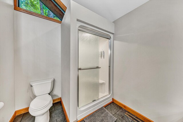 510 Crestview Rd, Wirtz, VA 24184 - full bathroom featuring toilet, baseboards, and a shower stall