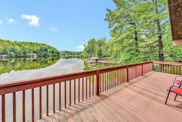 510 Crestview Rd, Wirtz, VA 24184 - wooden terrace featuring a water view and a wooded view