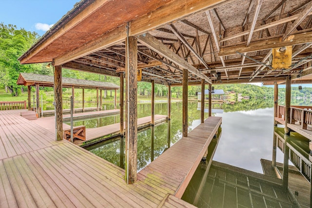 510 Crestview Rd, Wirtz, VA 24184 - dock area featuring boat lift, a water view, and view of scattered trees