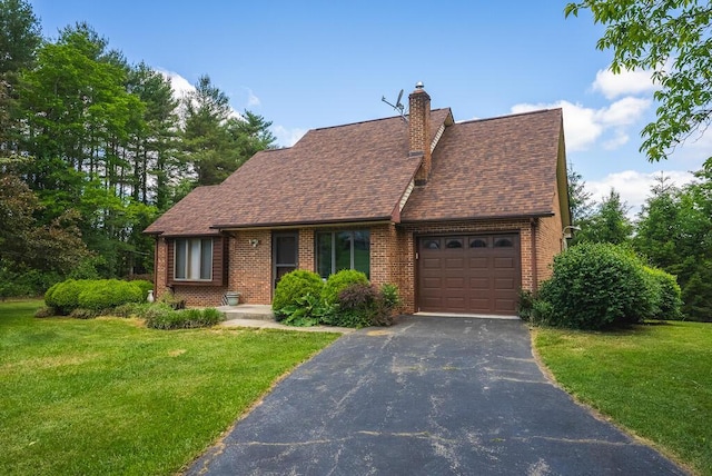 1978 Laurel Creek Rd NE, Pilot, VA 24138 - tudor home with an attached garage, brick siding, asphalt driveway, a front lawn, and a chimney