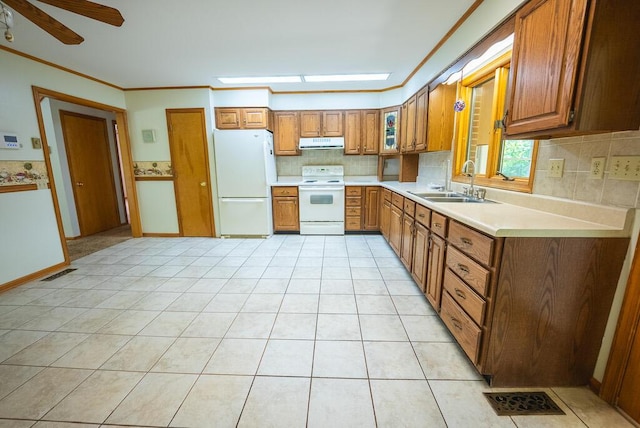 1978 Laurel Creek Rd NE, Pilot, VA 24138 - kitchen featuring white appliances, a sink, ventilation hood, brown cabinetry, and crown molding