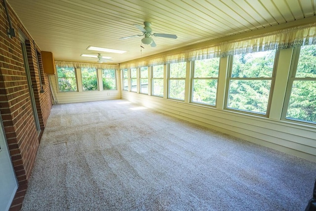 1978 Laurel Creek Rd NE, Pilot, VA 24138 - unfurnished sunroom with ceiling fan, carpet flooring, brick wall, and wooden walls
