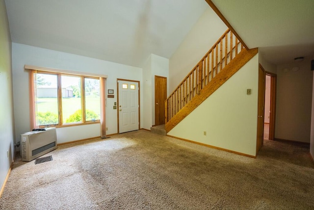 1978 Laurel Creek Rd NE, Pilot, VA 24138 - entrance foyer featuring carpet flooring, stairs, baseboards, heating unit, and lofted ceiling