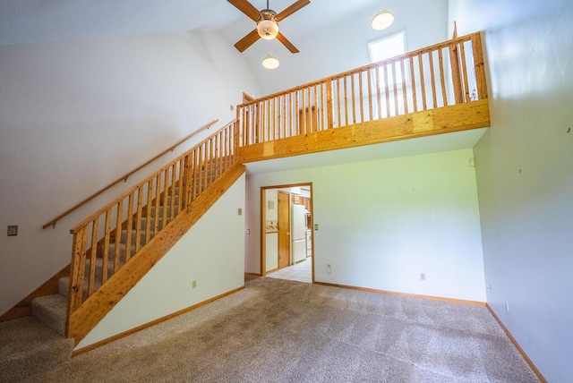 1978 Laurel Creek Rd NE, Pilot, VA 24138 - unfurnished living room with ceiling fan, high vaulted ceiling, carpet floors, stairway, and baseboards