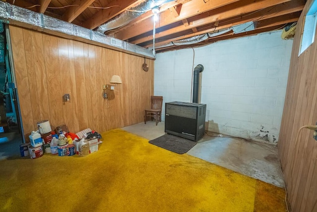 1978 Laurel Creek Rd NE, Pilot, VA 24138 - unfinished below grade area featuring a wood stove, heating unit, and concrete block wall