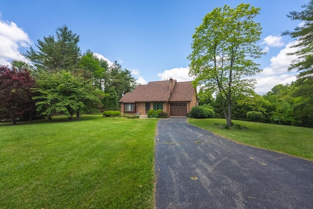 1978 Laurel Creek Rd NE, Pilot, VA 24138 - view of front of property featuring an attached garage, asphalt driveway, a front lawn, and brick siding