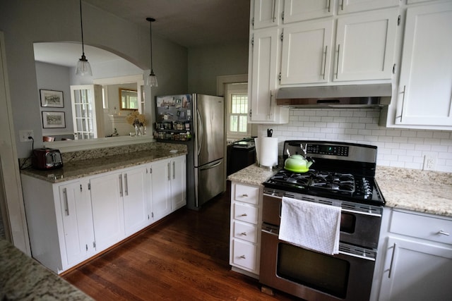 1810 Windsor Ave SW, Roanoke, VA 24015 - kitchen featuring stainless steel appliances, arched walkways, white cabinetry, under cabinet range hood, and dark wood finished floors