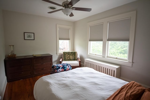 1810 Windsor Ave SW, Roanoke, VA 24015 - bedroom with radiator, wood finished floors, ceiling fan, and baseboards