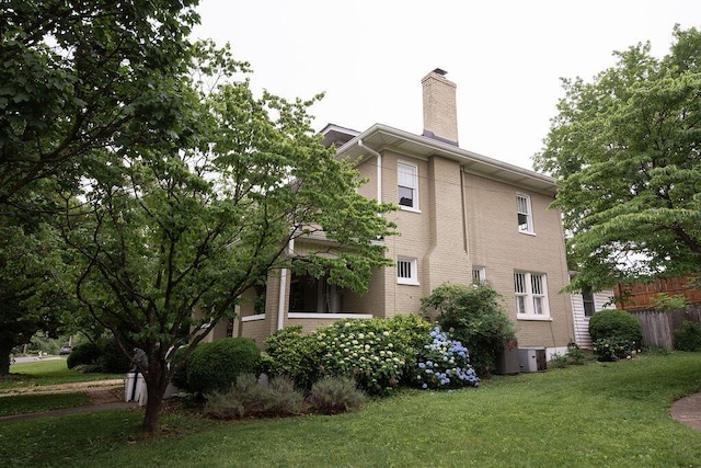 1810 Windsor Ave SW, Roanoke, VA 24015 - view of home's exterior with a chimney, central air condition unit, and brick siding