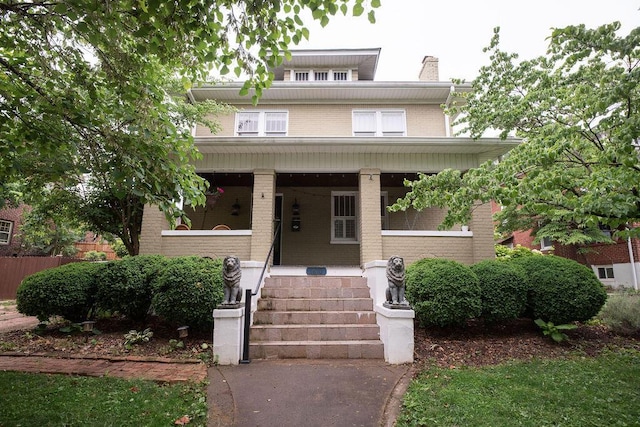 1810 Windsor Ave SW, Roanoke, VA 24015 - traditional style home with a porch, brick siding, and a chimney
