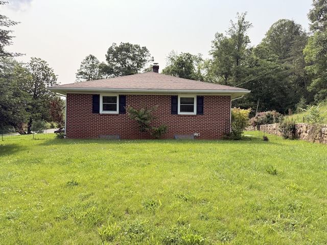 3135 Doe Run Rd, Rocky Mount, VA 24151 - view of side of property with a chimney, a yard, and brick siding