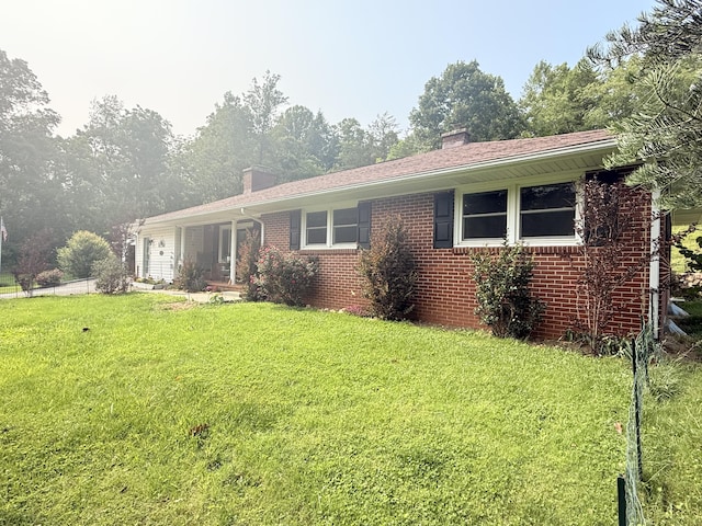 3135 Doe Run Rd, Rocky Mount, VA 24151 - single story home featuring a front yard, an attached garage, brick siding, and a chimney