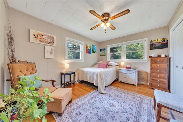 3135 Doe Run Rd, Rocky Mount, VA 24151 - bedroom with multiple windows, wood finished floors, and ceiling fan