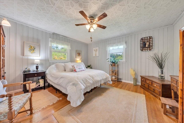 3135 Doe Run Rd, Rocky Mount, VA 24151 - bedroom featuring multiple windows, crown molding, wood finished floors, an ornate ceiling, and ceiling fan