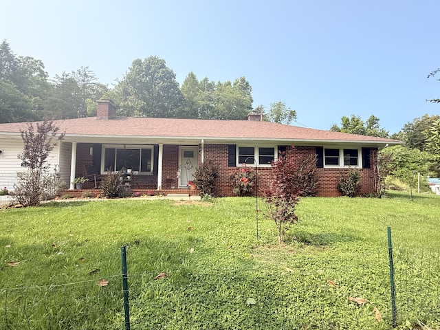 3135 Doe Run Rd, Rocky Mount, VA 24151 - ranch-style home with a chimney, a front lawn, covered porch, and brick siding