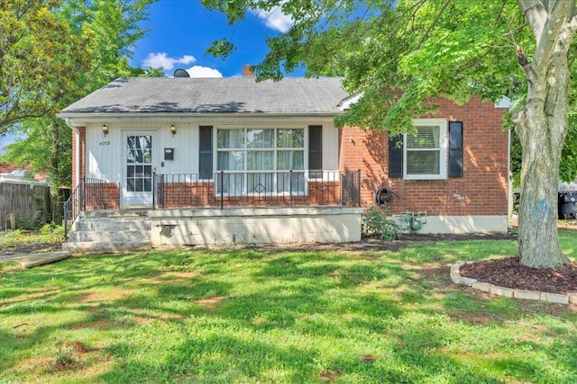 4708 Pawling St NW, Roanoke, VA 24012 - view of front facade featuring brick siding, a front lawn, and covered porch