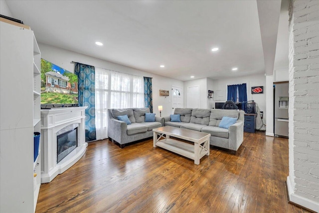 4708 Pawling St NW, Roanoke, VA 24012 - living area featuring dark wood-style floors, recessed lighting, and a glass covered fireplace