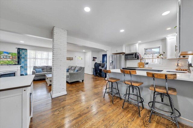 4708 Pawling St NW, Roanoke, VA 24012 - kitchen featuring open floor plan, a sink, appliances with stainless steel finishes, plenty of natural light, and recessed lighting