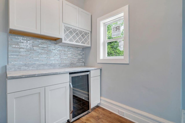 3311 Memorial Ave, Lynchburg, VA 24501 - indoor dry bar featuring beverage cooler, tasteful backsplash, and light wood-style floors